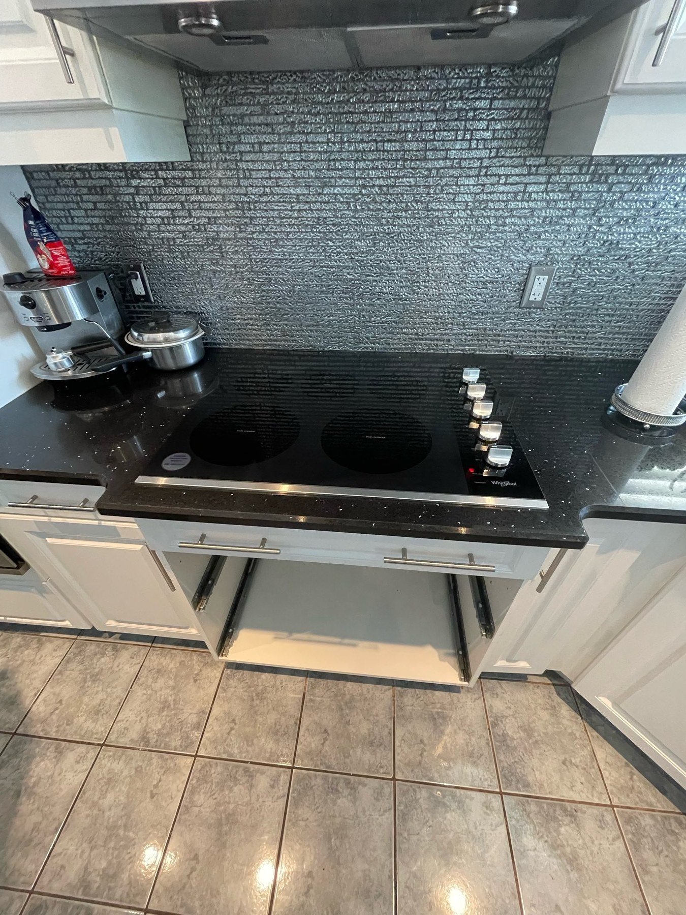 Installed black glass cooktop